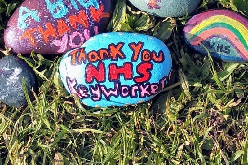 painted messages to nhs key workers on rocks.